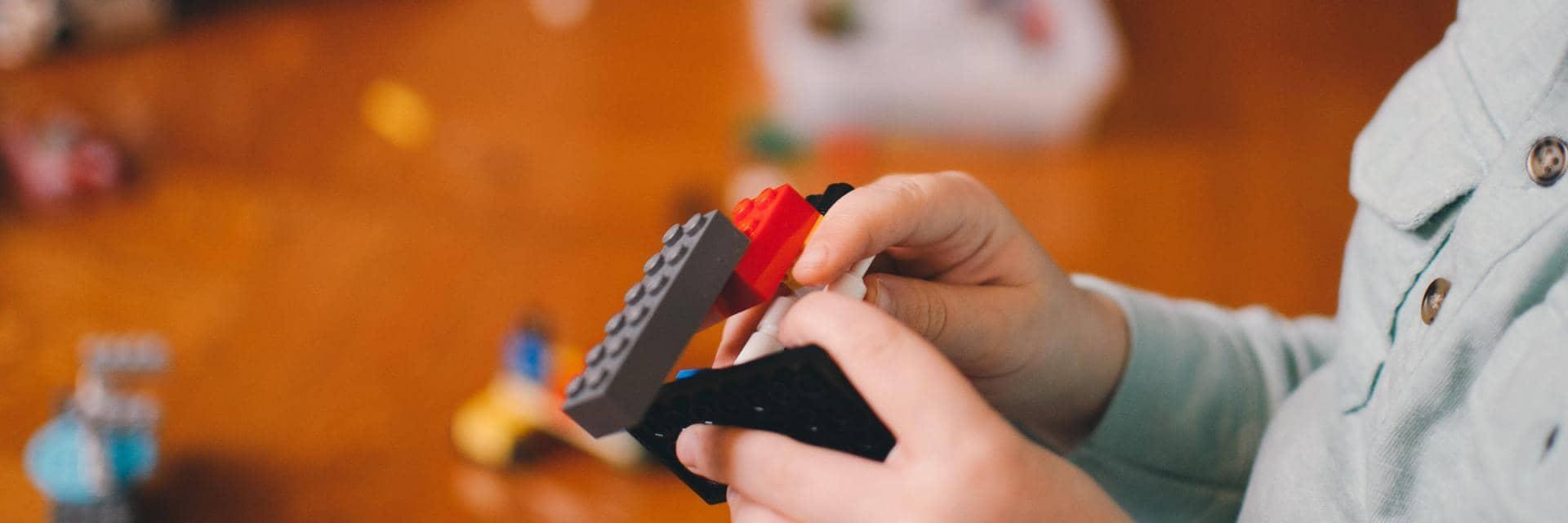  A child playing with Lego bricks