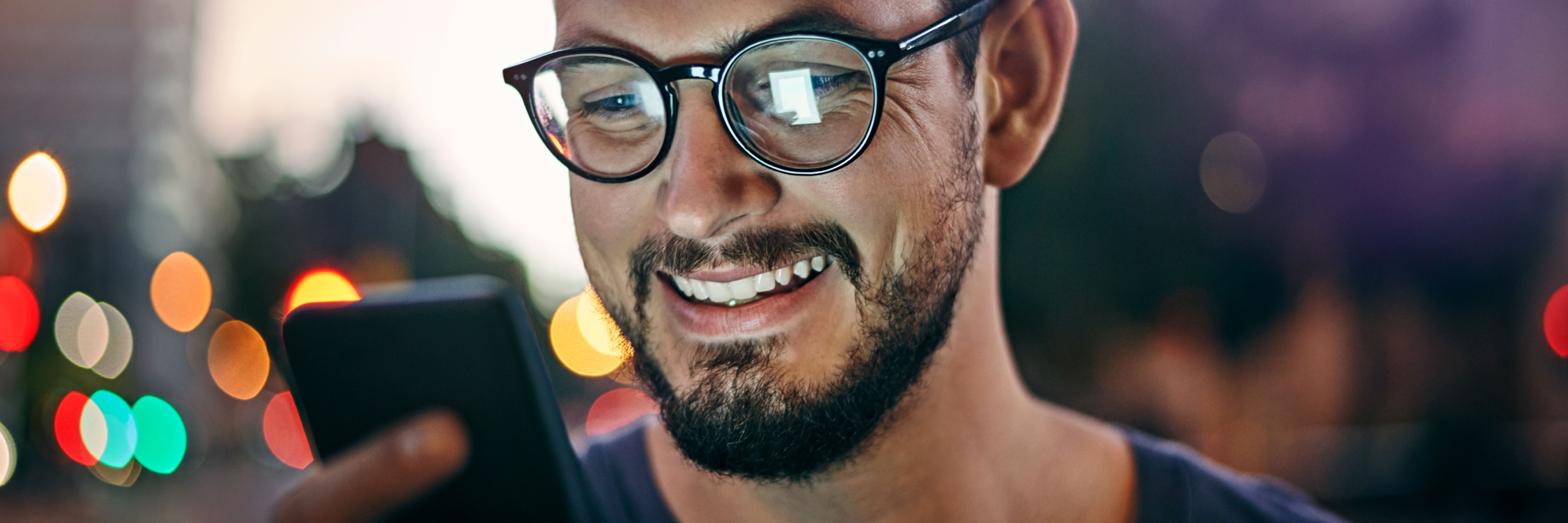 Person smiling at phone